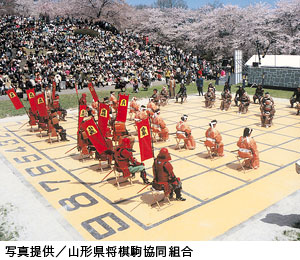 Local high school students perform Ningen Shogi, human Japanese chess on  top of Mt. Maizuru, in Tendo, Yamagata Prefecture on April 22, 2017. Tendo  is known for production of shogi koma,'' pieces